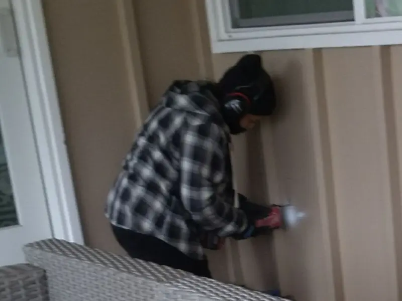 Professional electrician installing an exterior outlet in Elizabeth